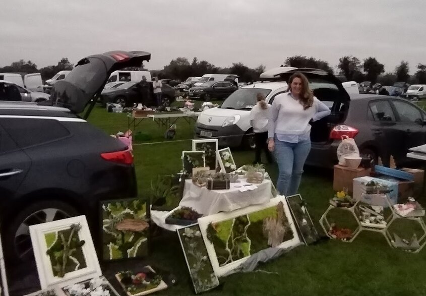 My Nádúr Crafts car boot sale display with framed upcycled artwork